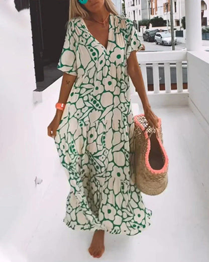 Maxi dress featuring a V-neckline and ruffles, designed for summer outings. 6