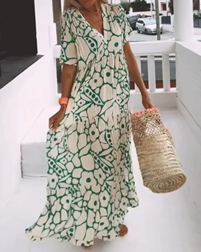 Maxi dress featuring a V-neckline and ruffles, designed for summer outings. 7