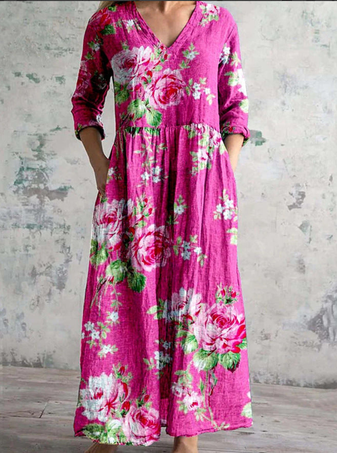 Maxi dress featuring a V-neckline and rolled sleeves, displayed on a mannequin against a neutral background. 3