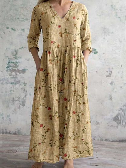 Maxi dress featuring a V-neckline and rolled sleeves, displayed on a mannequin against a neutral background. 4