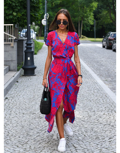 Maxi dress with short sleeves and a wrap neckline, designed for formal occasions such as weddings. 0