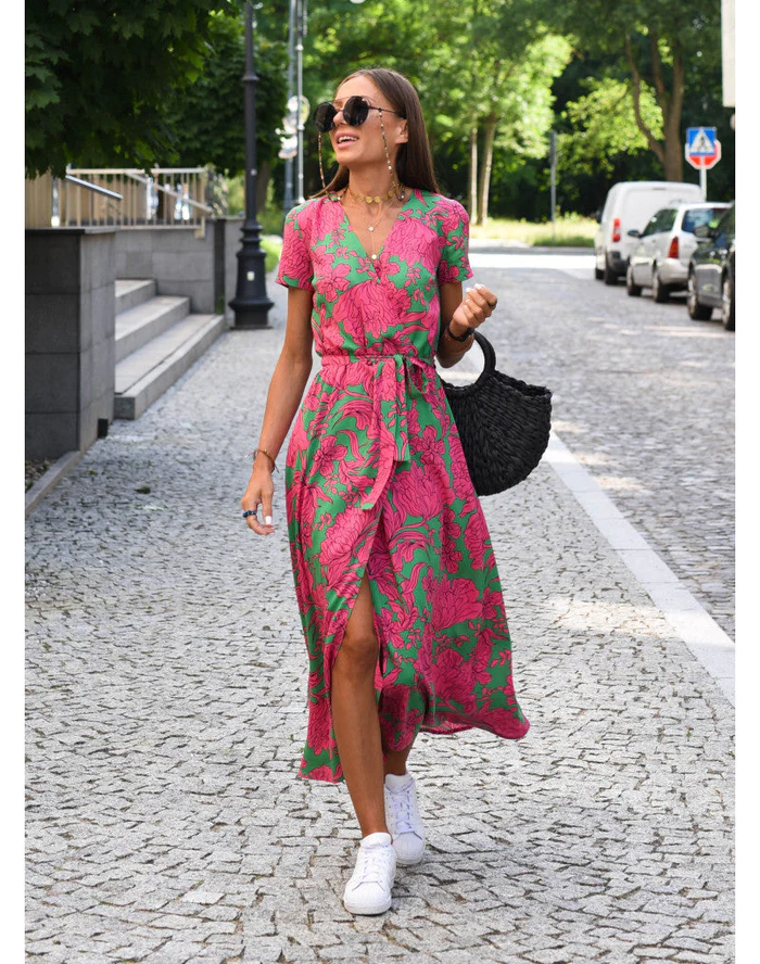 Maxi dress with short sleeves and a wrap neckline, designed for formal occasions such as weddings. 1