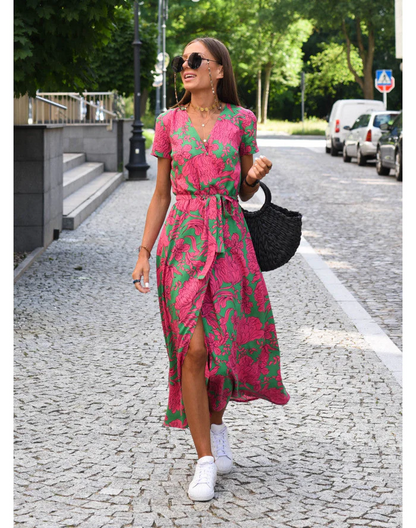 Maxi dress with short sleeves and a wrap neckline, designed for formal occasions such as weddings. 1