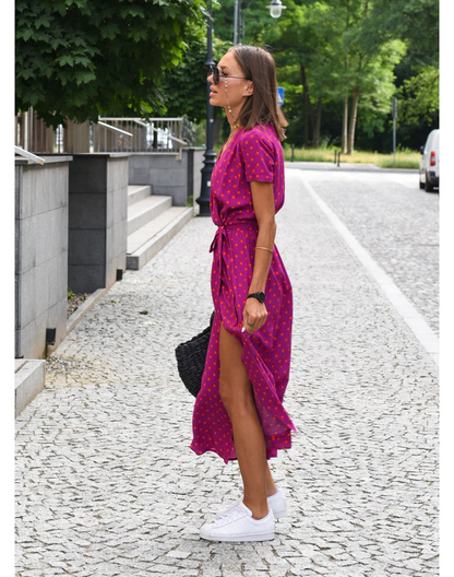 Maxi dress with short sleeves and a wrap neckline, designed for formal occasions such as weddings. 4