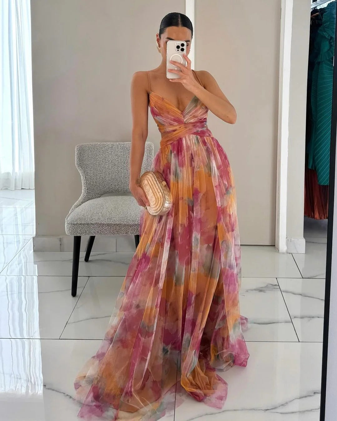Maxi dress featuring a floral print and adjustable fastening. The dress has a flowing silhouette and is designed for women. 0