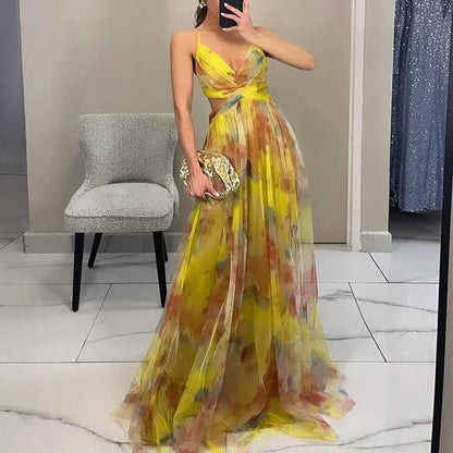 Maxi dress featuring a floral print and adjustable fastening. The dress has a flowing silhouette and is designed for women. 2
