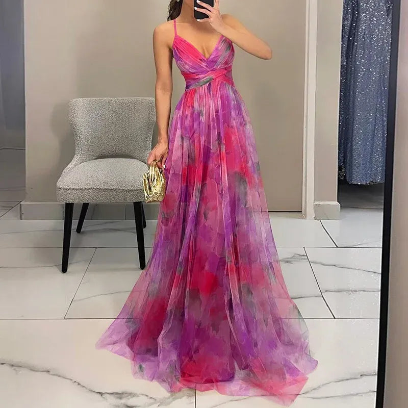 Maxi dress featuring a floral print and adjustable fastening. The dress has a flowing silhouette and is designed for women. 3