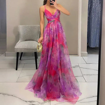 Maxi dress featuring a floral print and adjustable fastening. The dress has a flowing silhouette and is designed for women. 3