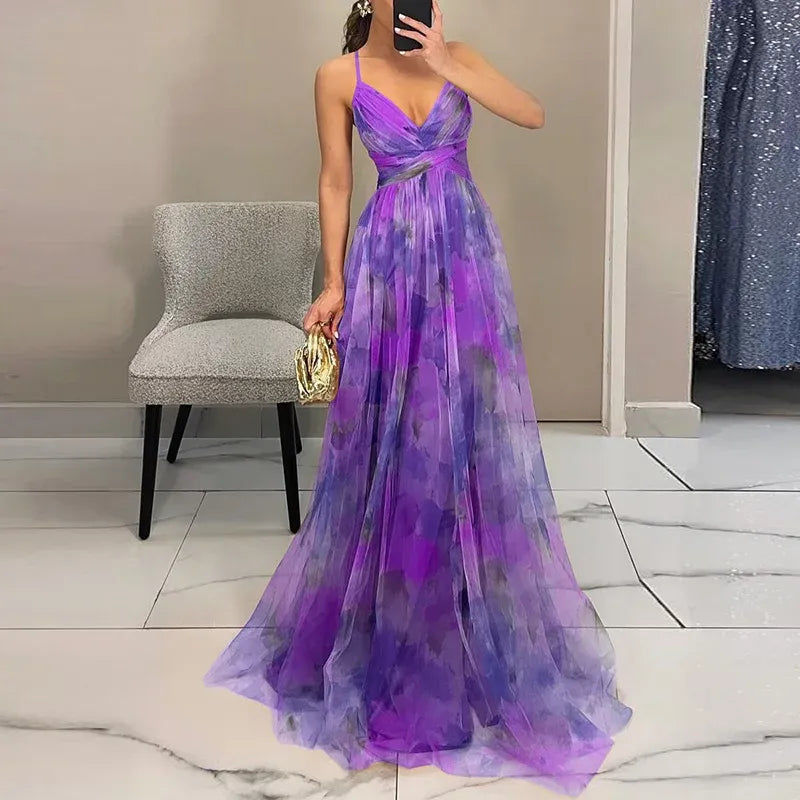 Maxi dress featuring a floral print and adjustable fastening. The dress has a flowing silhouette and is designed for women. 4