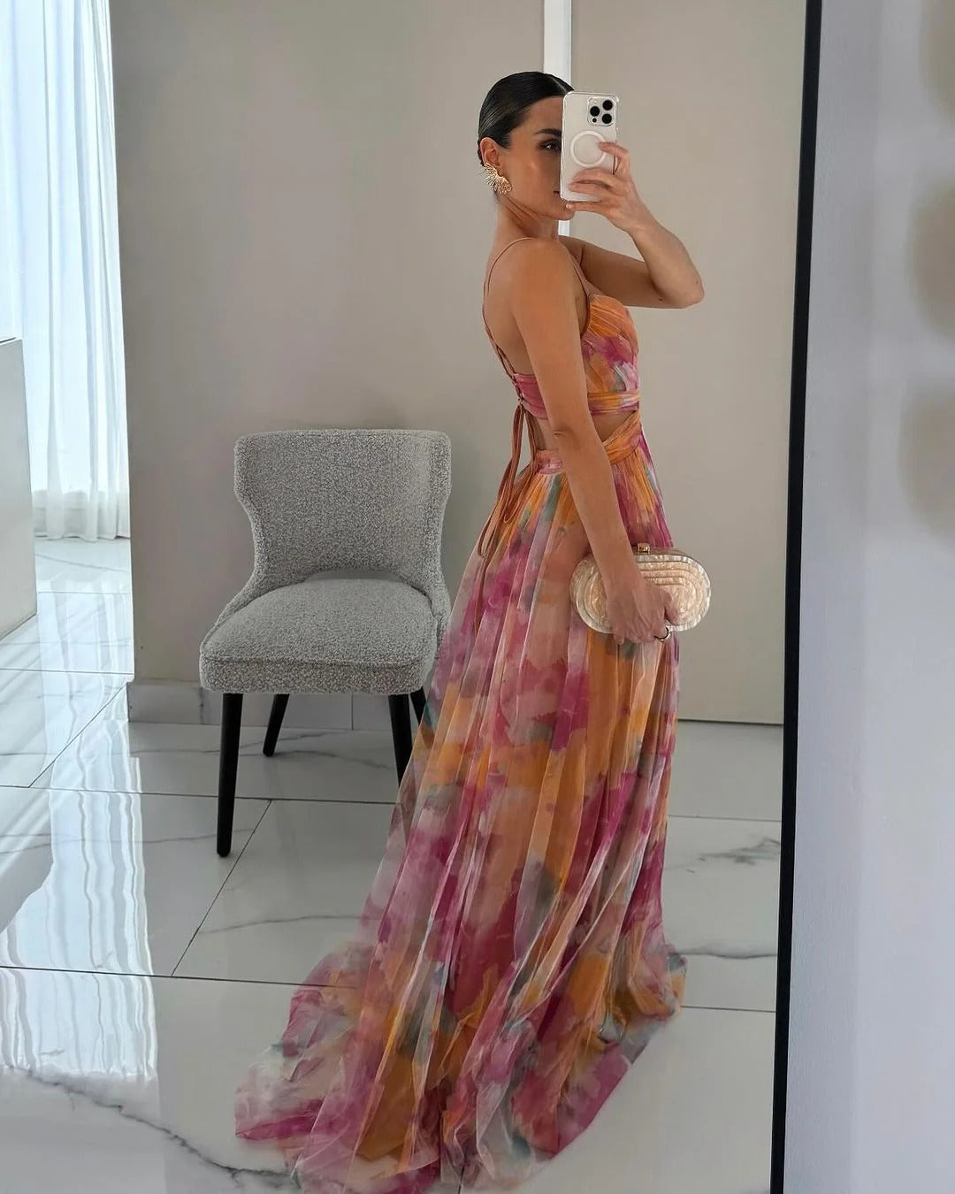 Maxi dress featuring a floral print and adjustable fastening. The dress has a flowing silhouette and is designed for women. 5
