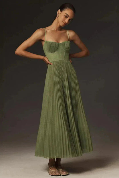 Midi dress featuring a pleated design, showcasing a flowing silhouette and a stylish, feminine cut. 0