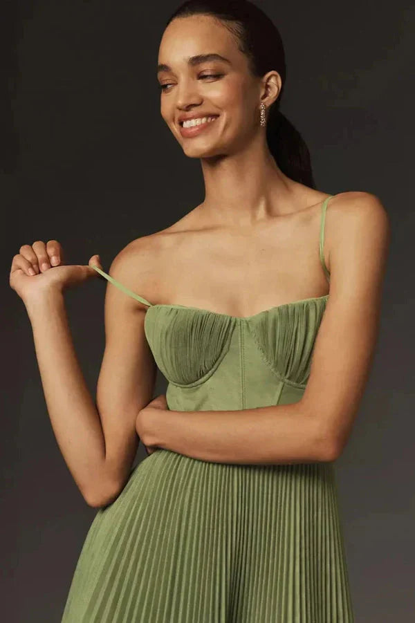 Midi dress featuring a pleated design, showcasing a flowing silhouette and a stylish, feminine cut. 1