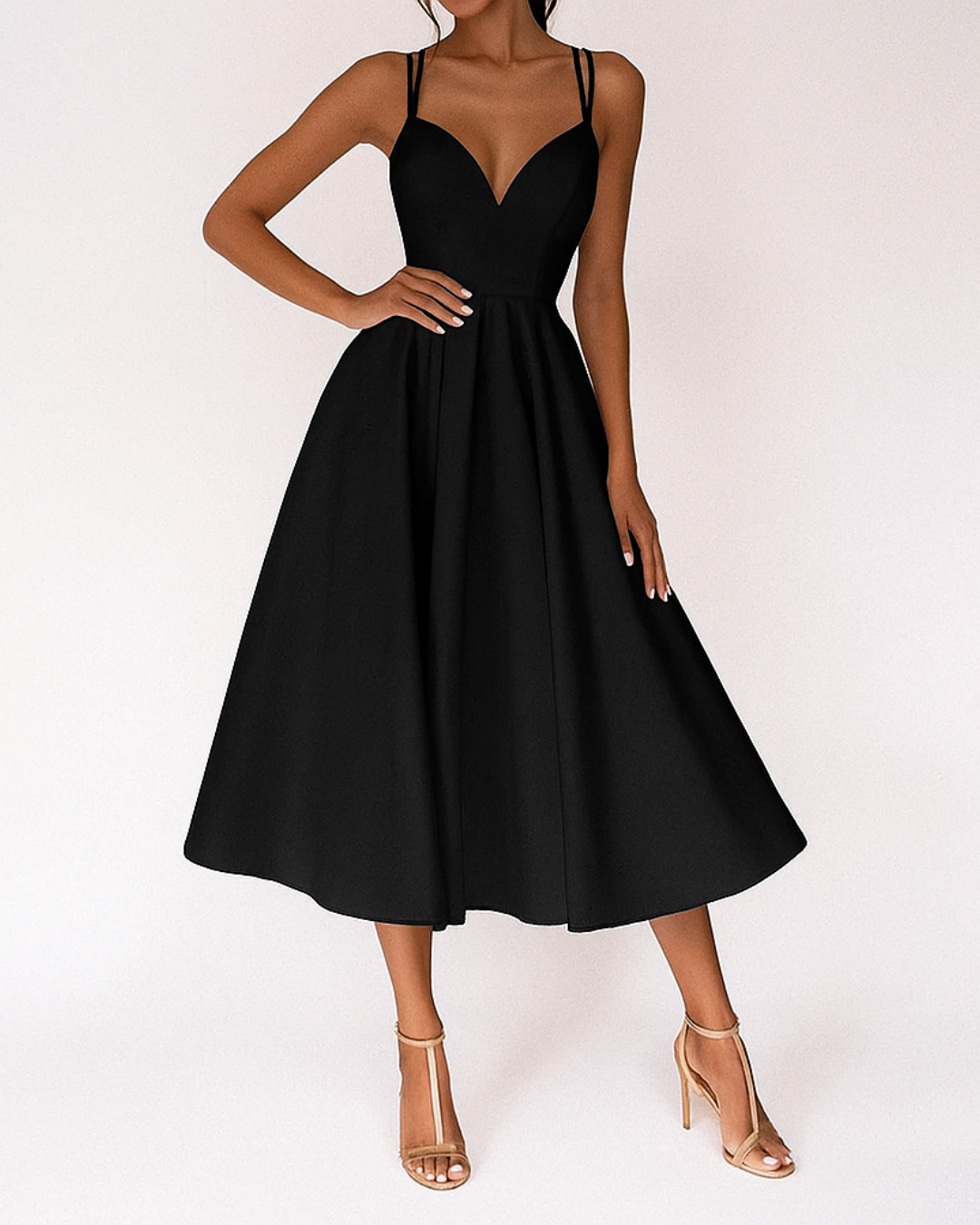 Dresses: A midi dress with spaghetti straps featuring an elegant accent, designed for formal occasions like weddings. 3