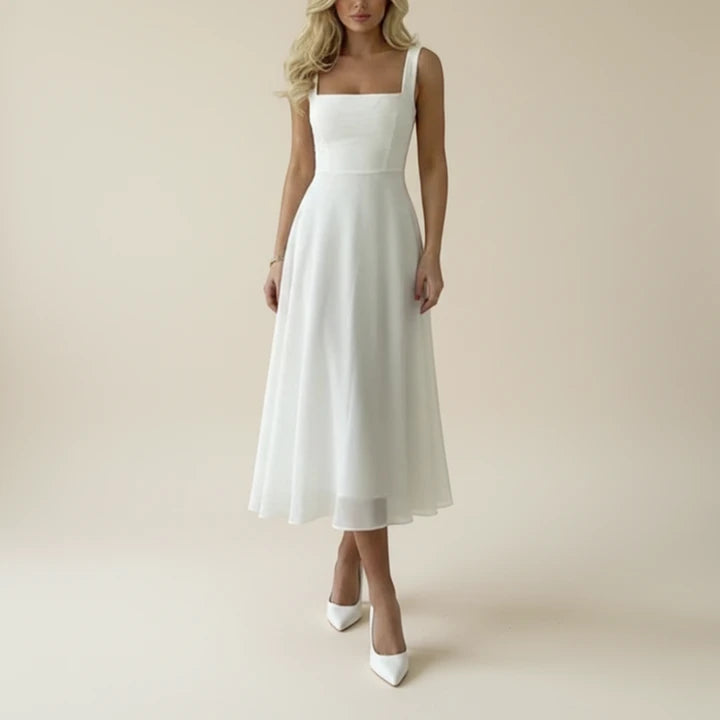 A sleeveless midi dress featuring a square neckline, designed for formal occasions such as weddings. The dress has a fitted bodice and a flowing skirt, 0