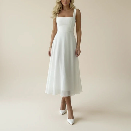 A sleeveless midi dress featuring a square neckline, designed for formal occasions such as weddings. The dress has a fitted bodice and a flowing skirt, 0