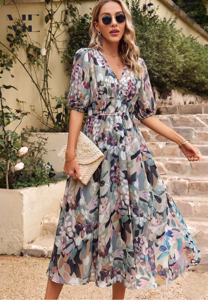 Midi dress featuring a floral print and puff sleeves. 0