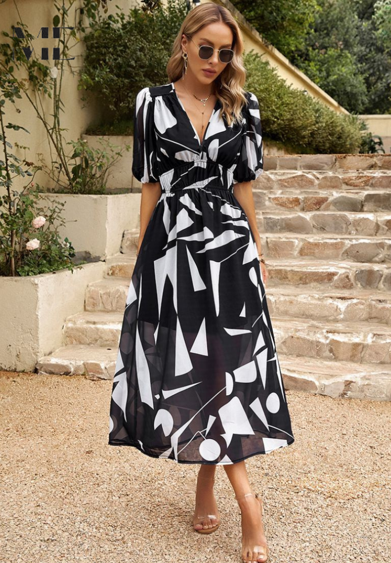 Midi dress featuring a floral print and puff sleeves. 10