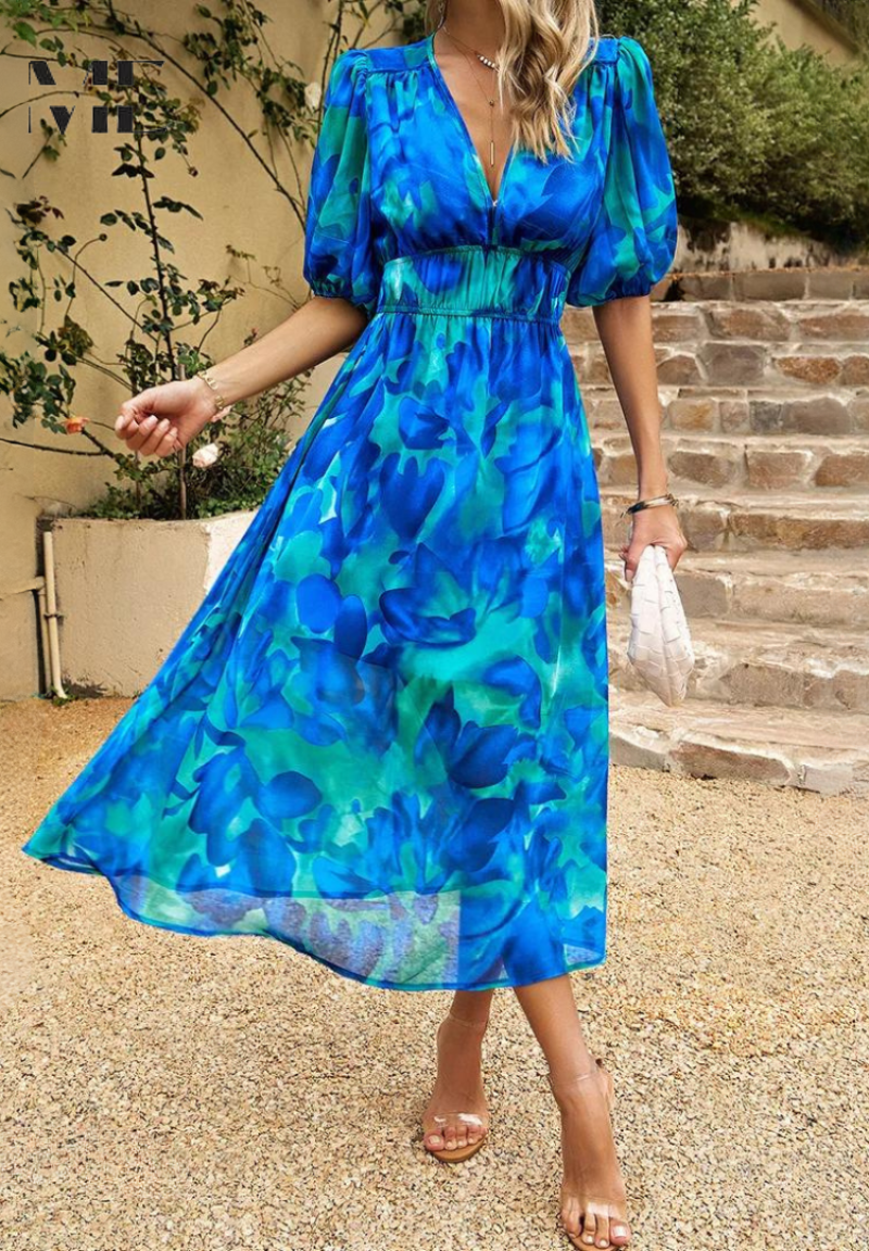 Midi dress featuring a floral print and puff sleeves. 5