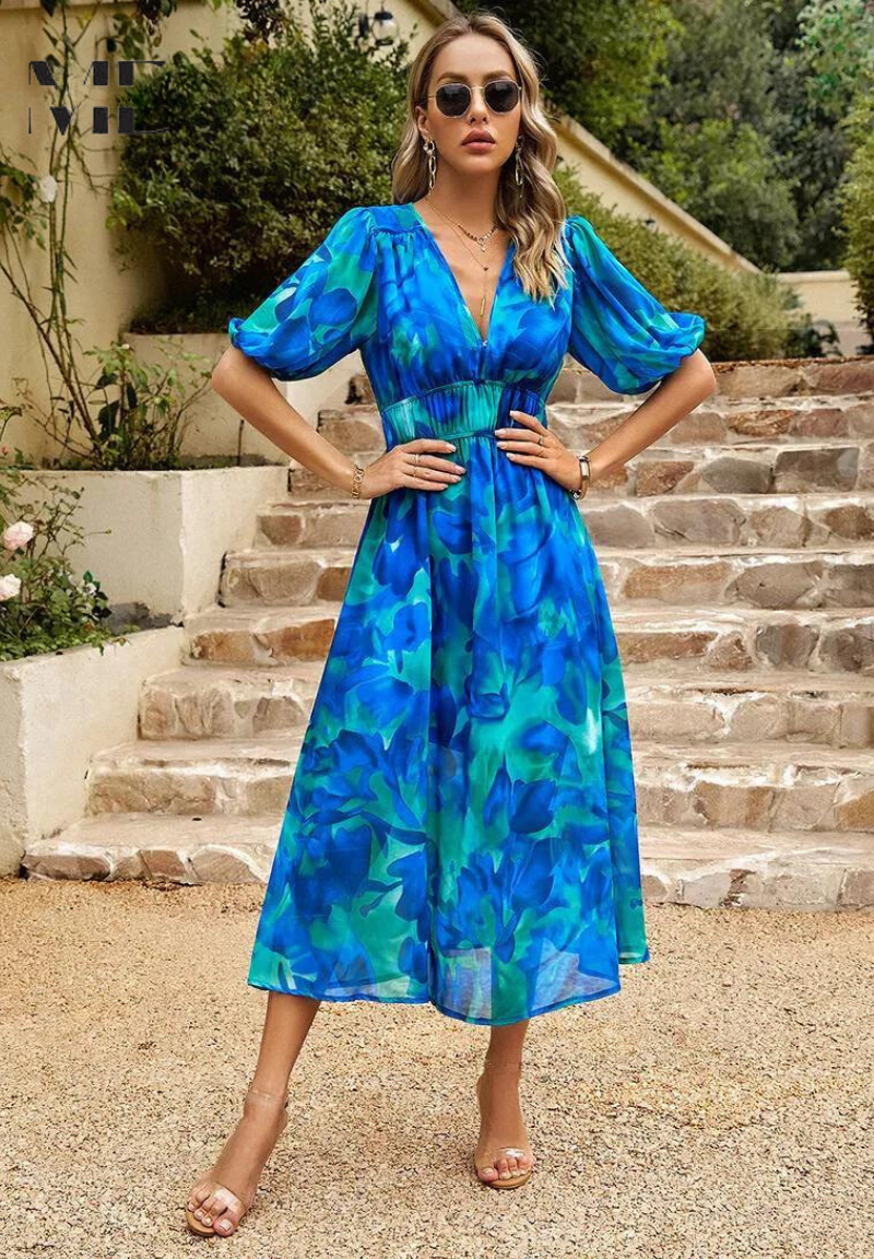 Midi dress featuring a floral print and puff sleeves. 6