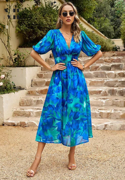 Midi dress featuring a floral print and puff sleeves. 6