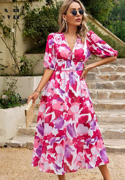 Midi dress featuring a floral print and puff sleeves. 9