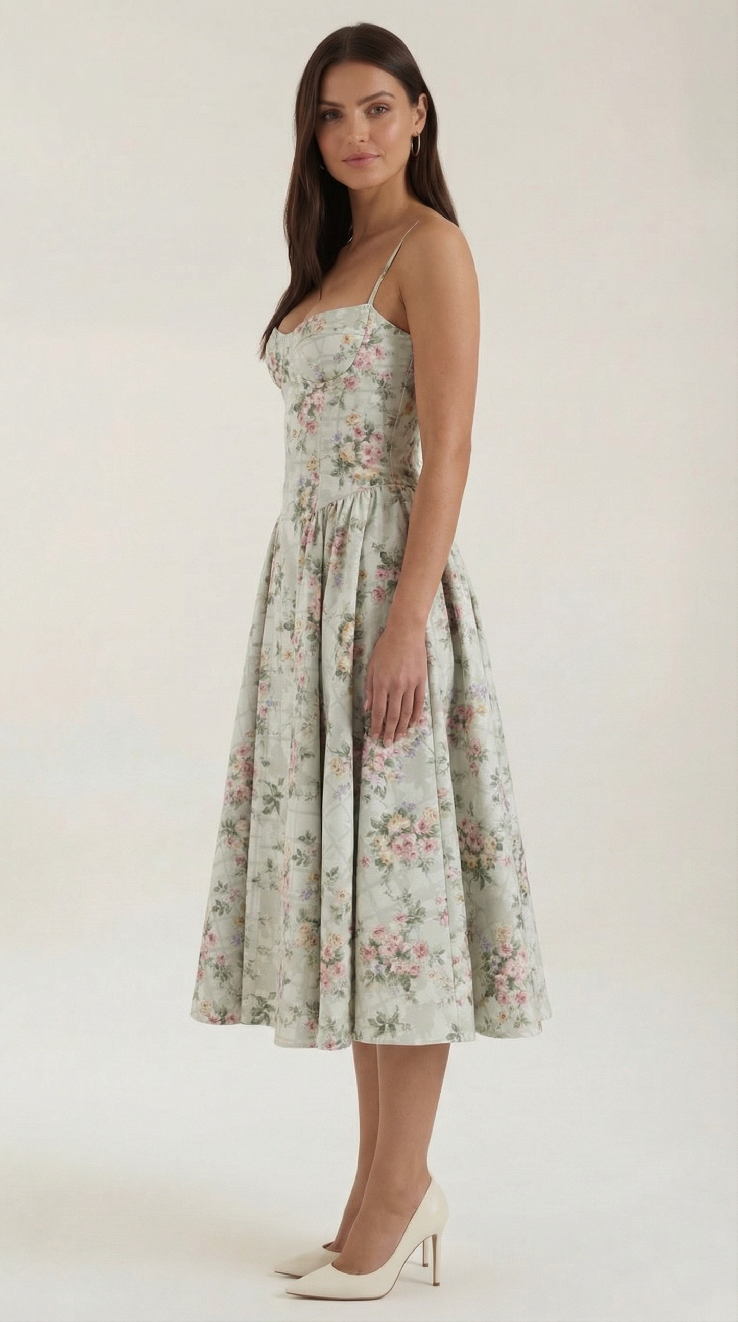 A midi dress featuring a floral print and a corset-style belt, designed for women's formal events such as weddings and summer celebrations. 1