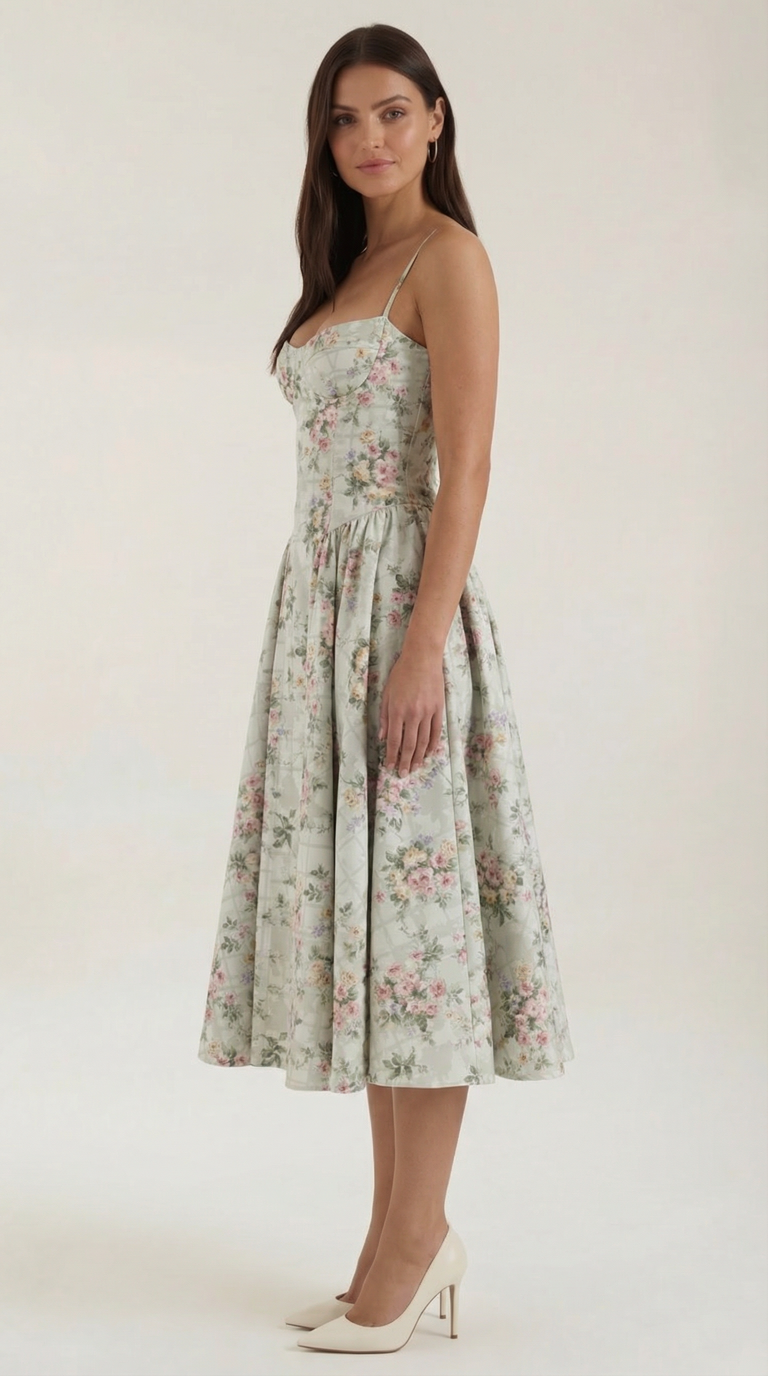 A midi dress featuring a floral print and a corset-style belt, designed for women's formal events such as weddings and summer celebrations. 1