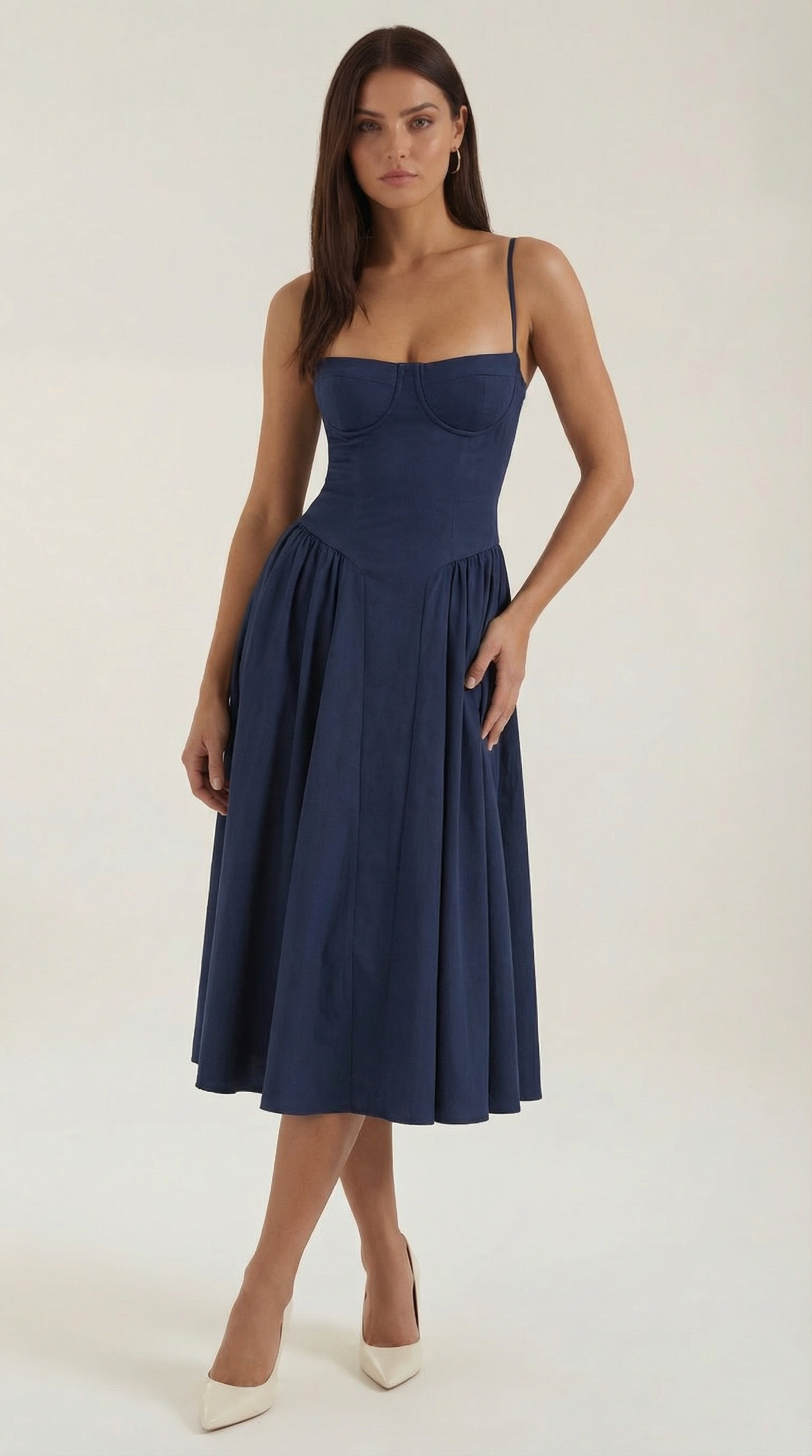 A midi dress featuring a floral print and a corset-style belt, designed for women's formal events such as weddings and summer celebrations. 12