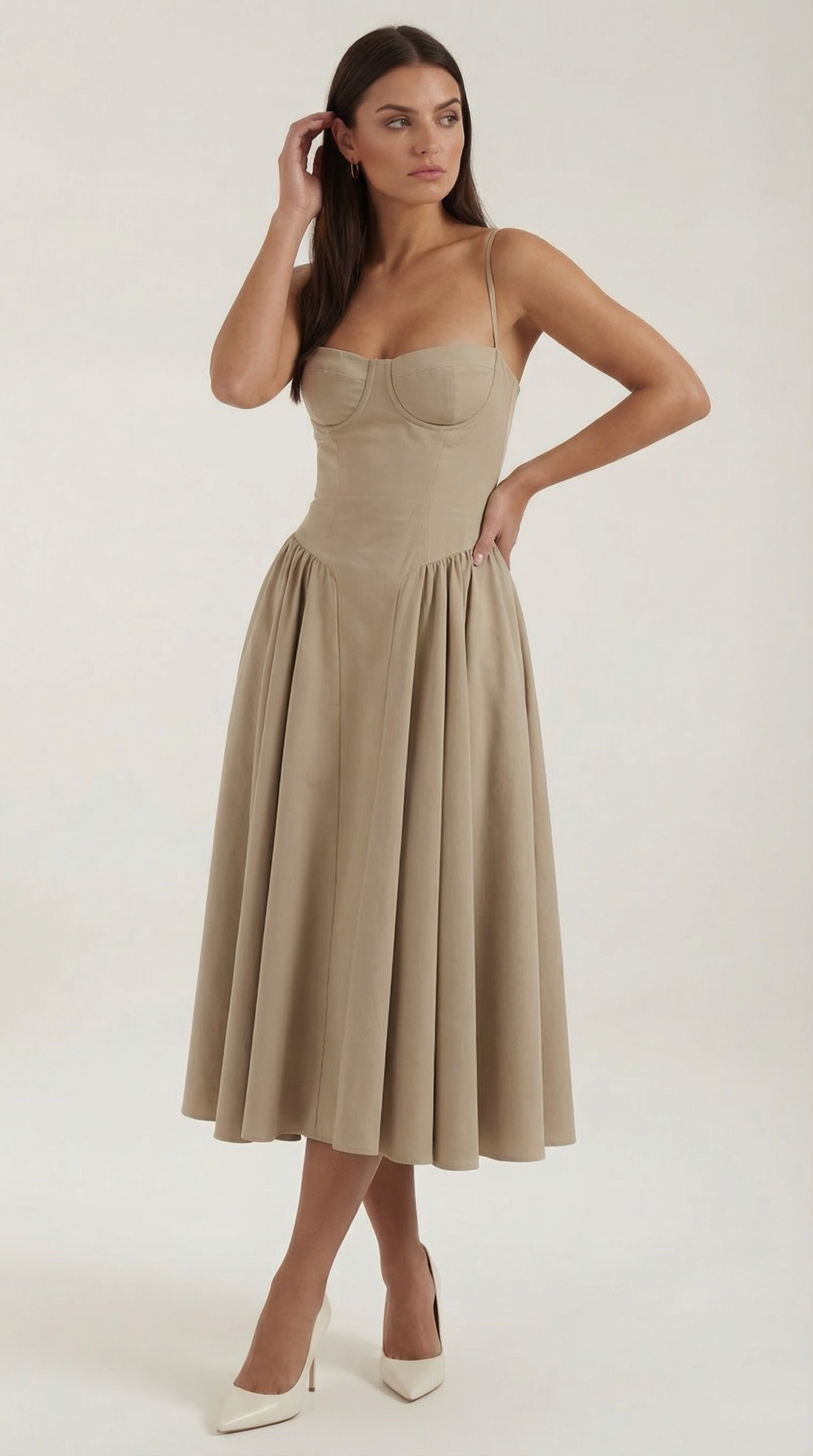 A midi dress featuring a floral print and a corset-style belt, designed for women's formal events such as weddings and summer celebrations. 13