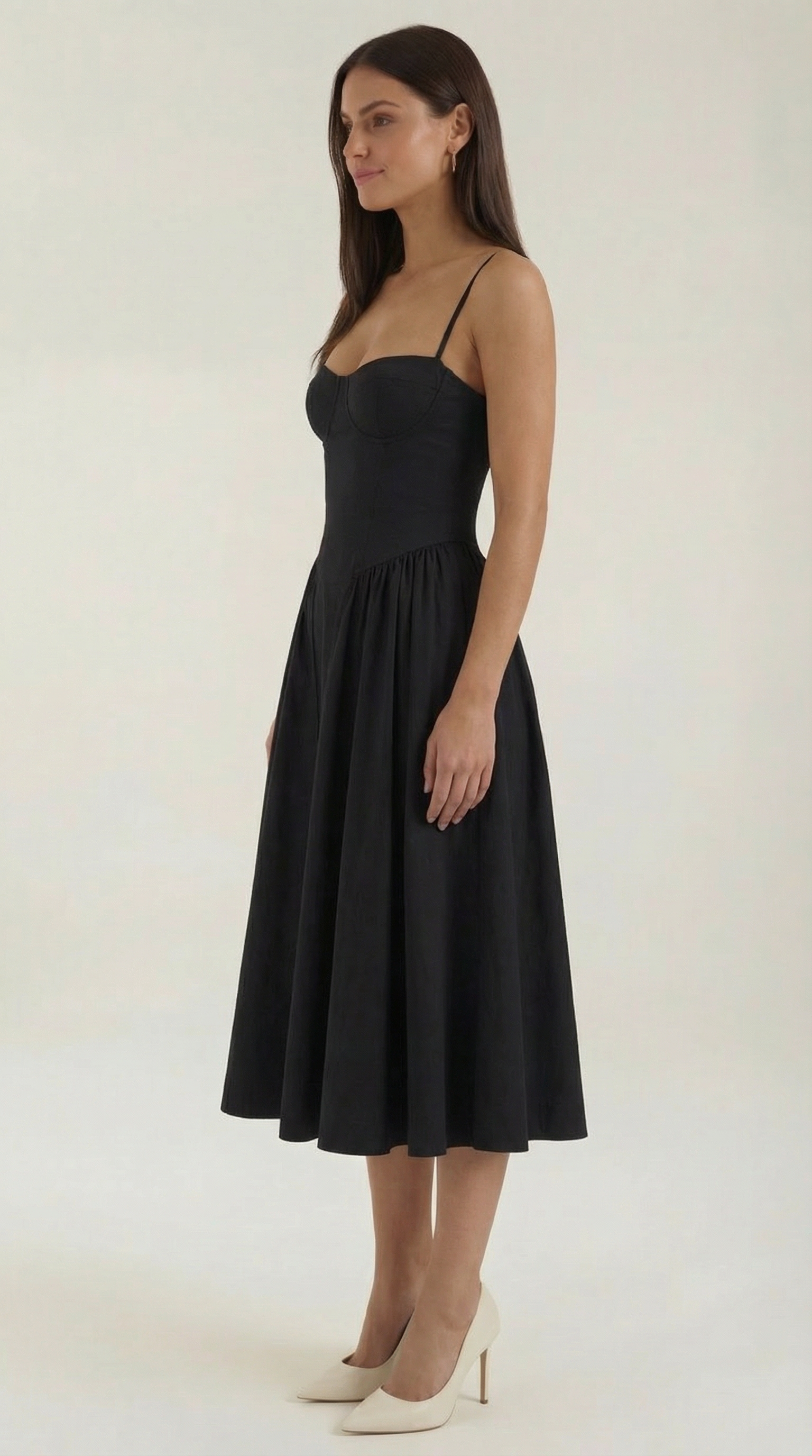 A midi dress featuring a floral print and a corset-style belt, designed for women's formal events such as weddings and summer celebrations. 6