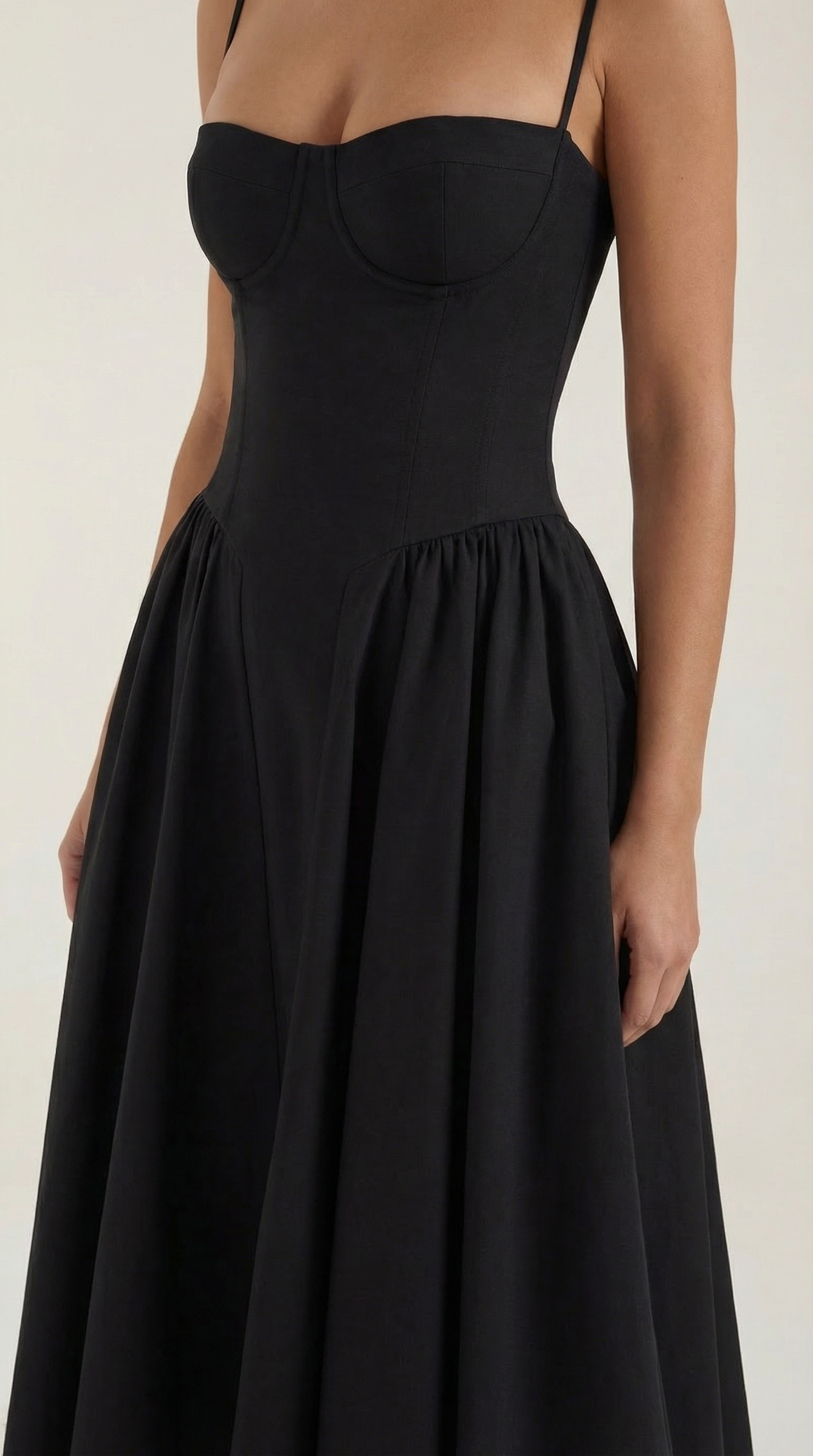 A midi dress featuring a floral print and a corset-style belt, designed for women's formal events such as weddings and summer celebrations. 7