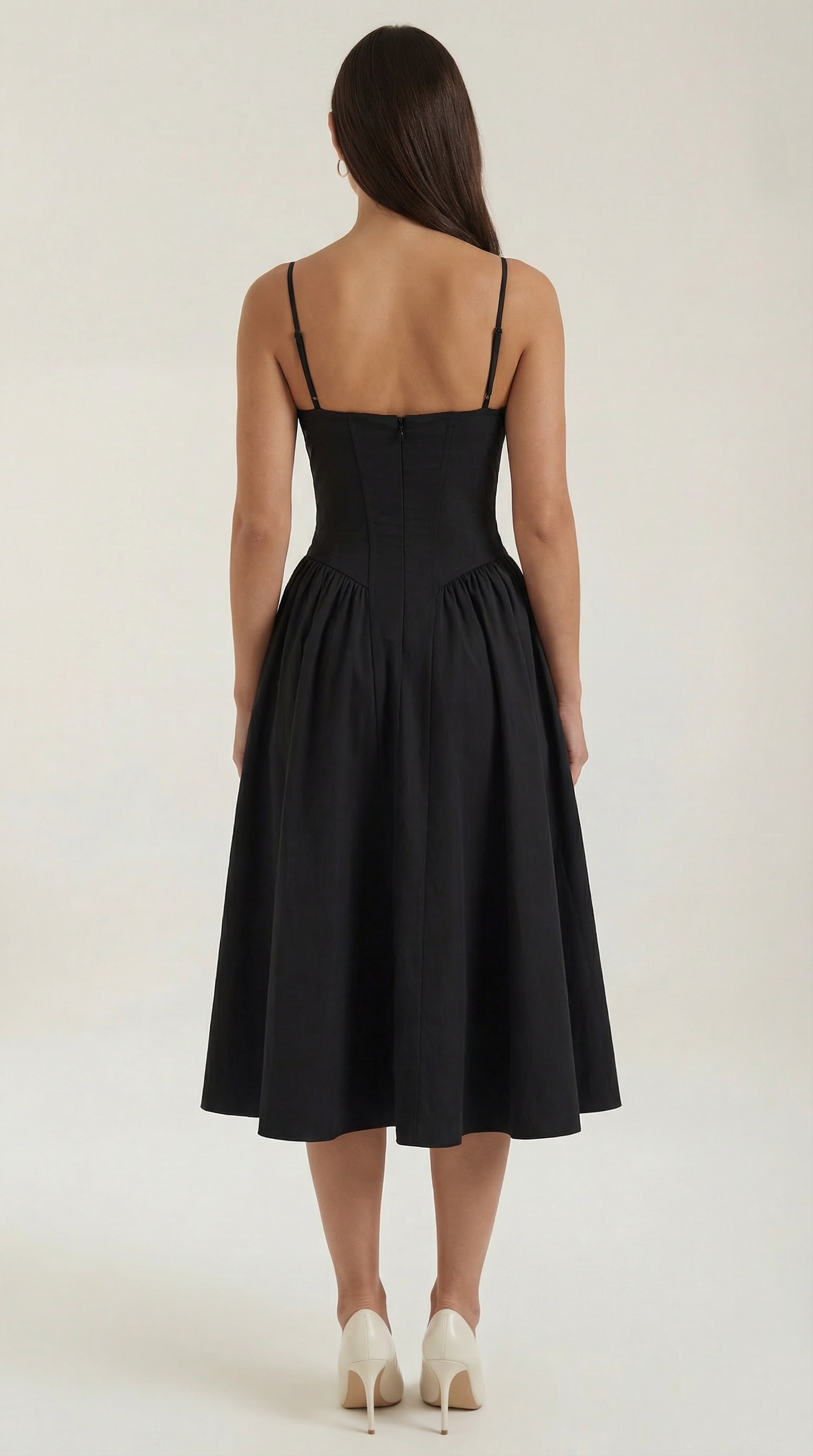 A midi dress featuring a floral print and a corset-style belt, designed for women's formal events such as weddings and summer celebrations. 8