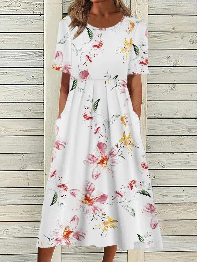 Dresses a midi length featuring a floral print and a round neckline, suitable for formal events like weddings. 2