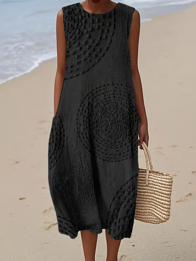 Maxi beach dress with elegant finishing and delicate straps, featuring a flowing silhouette and layered design. 1