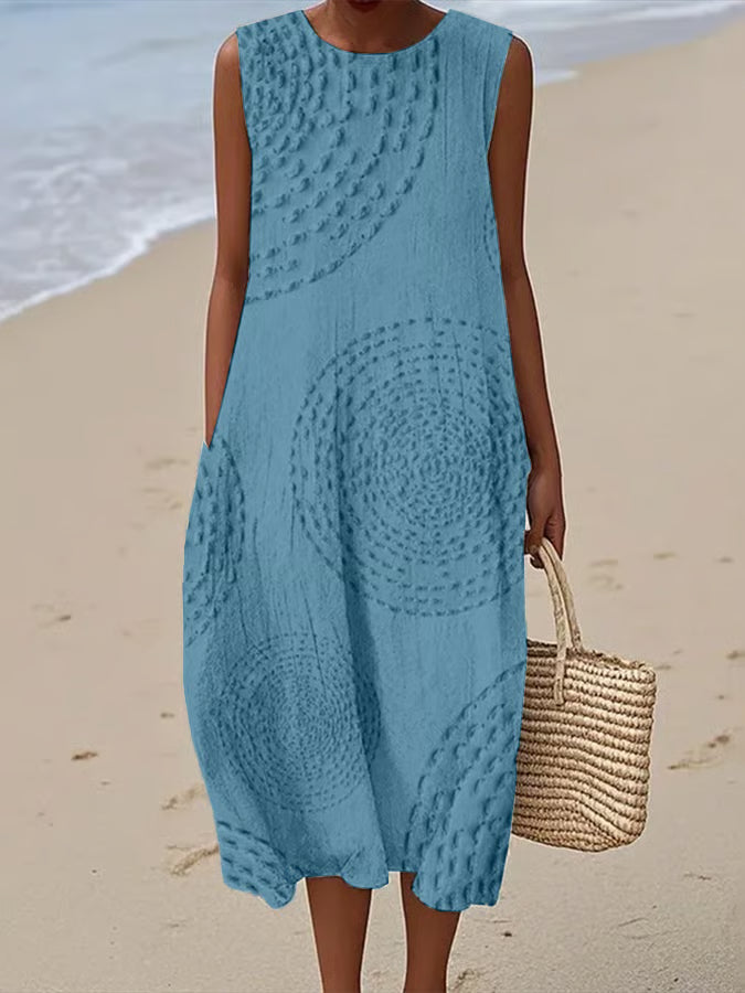 Maxi beach dress with elegant finishing and delicate straps, featuring a flowing silhouette and layered design. 3
