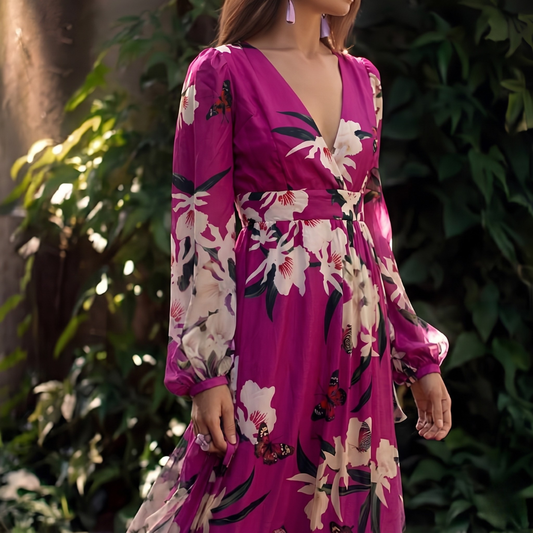 A women's dress featuring a floral pattern and a flowing silhouette, designed with short sleeves and a knee-length cut. 2