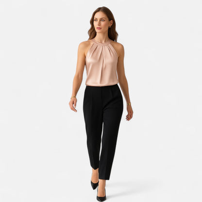 Women's sleeveless vest featuring a pleated front and draped pattern design. 1