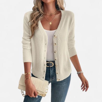 Long black cardigan for women featuring buttons down the front. 1
