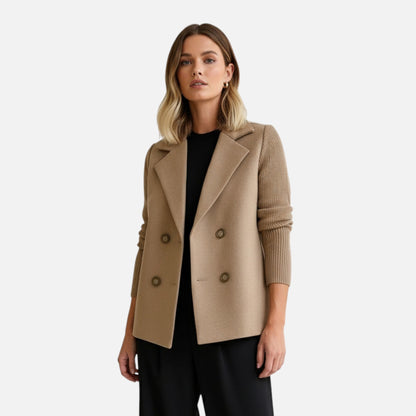 Elegant women's winter coat featuring a classic cut and comfortable fit, displayed on a hanger against a neutral background. 1