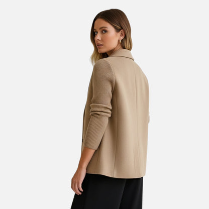 Elegant women's winter coat featuring a classic cut and comfortable fit, displayed on a hanger against a neutral background. 2