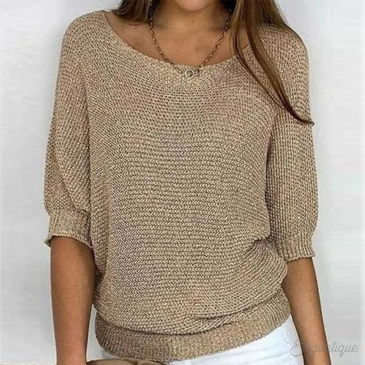 Loose women's sweater with a round neckline, featuring a relaxed fit and long sleeves, displayed on a neutral background. 0