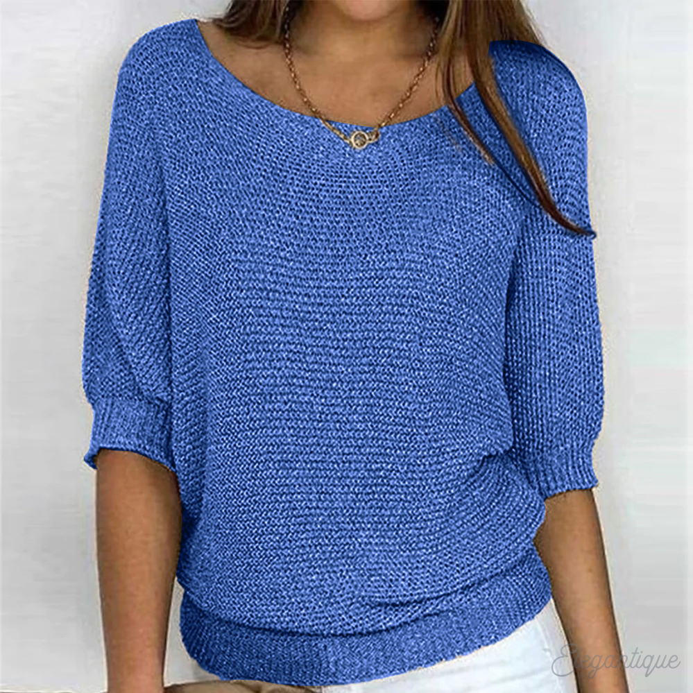 Loose women's sweater with a round neckline, featuring a relaxed fit and long sleeves, displayed on a neutral background. 3