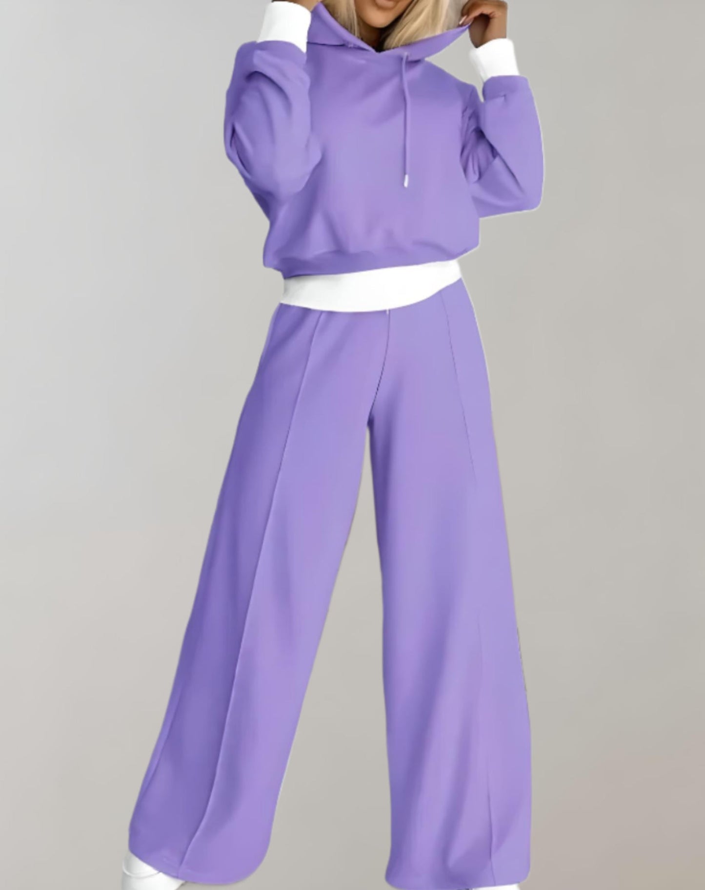 Women's recreational set featuring a hooded top and jogger pants. The outfit is displayed on a neutral background, showcasing the comfortable fit and casual style. 1