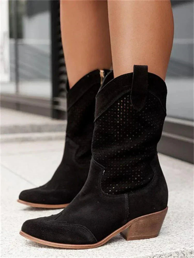 A pair of women's heeled cowboy boots featuring a cut-out design and a side zipper for easy wear. 3
