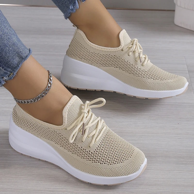 Women's athletic shoes featuring a mesh upper and a non-slip sole. 0