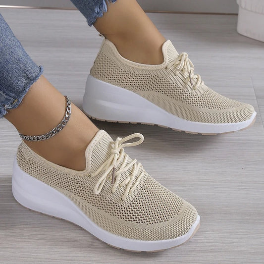 Women's athletic shoes featuring a mesh upper and a non-slip sole. 0