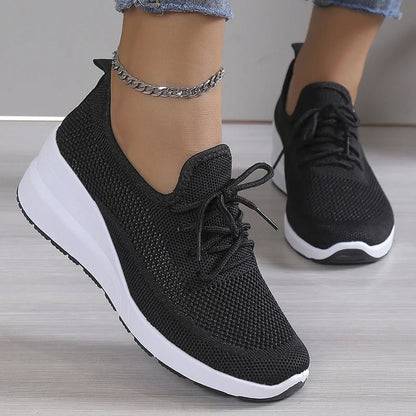 Women's athletic shoes featuring a mesh upper and a non-slip sole. 3