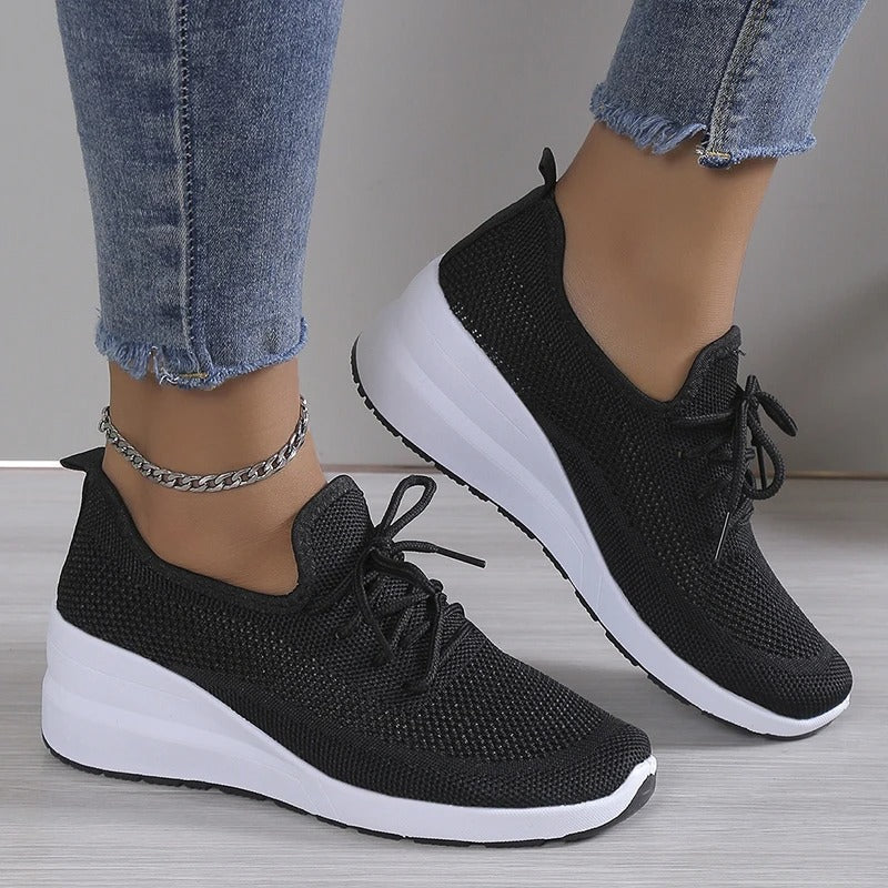 Women's athletic shoes featuring a mesh upper and a non-slip sole. 4