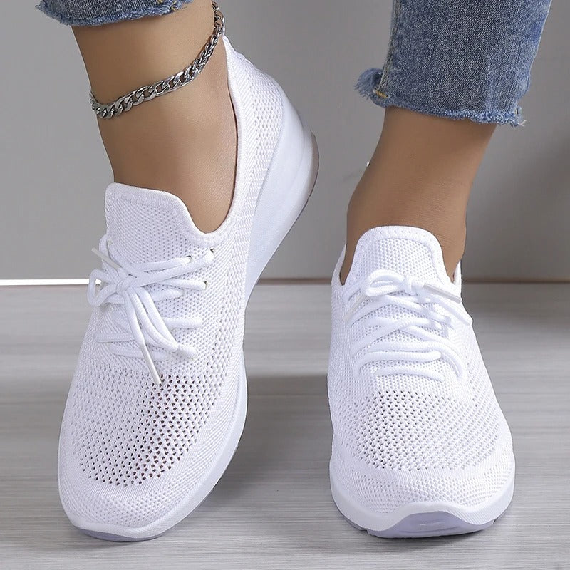 Women's athletic shoes featuring a mesh upper and a non-slip sole. 5