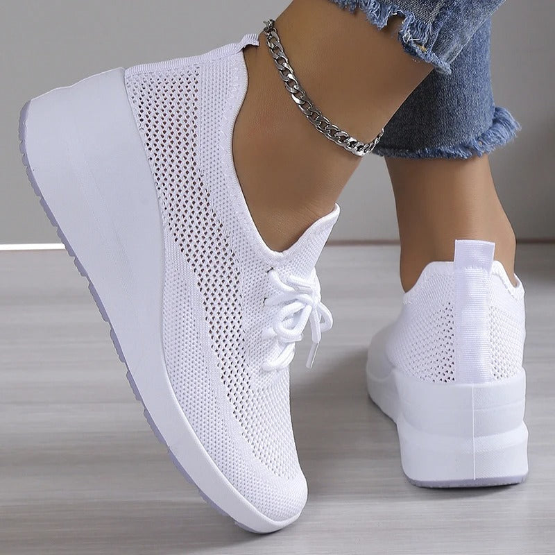 Women's athletic shoes featuring a mesh upper and a non-slip sole. 6